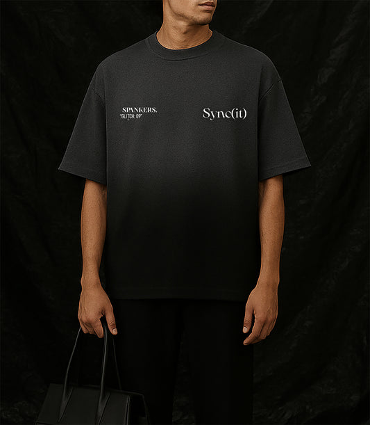spankers ombre Person wearing a black t-shirt with white text on a dark background