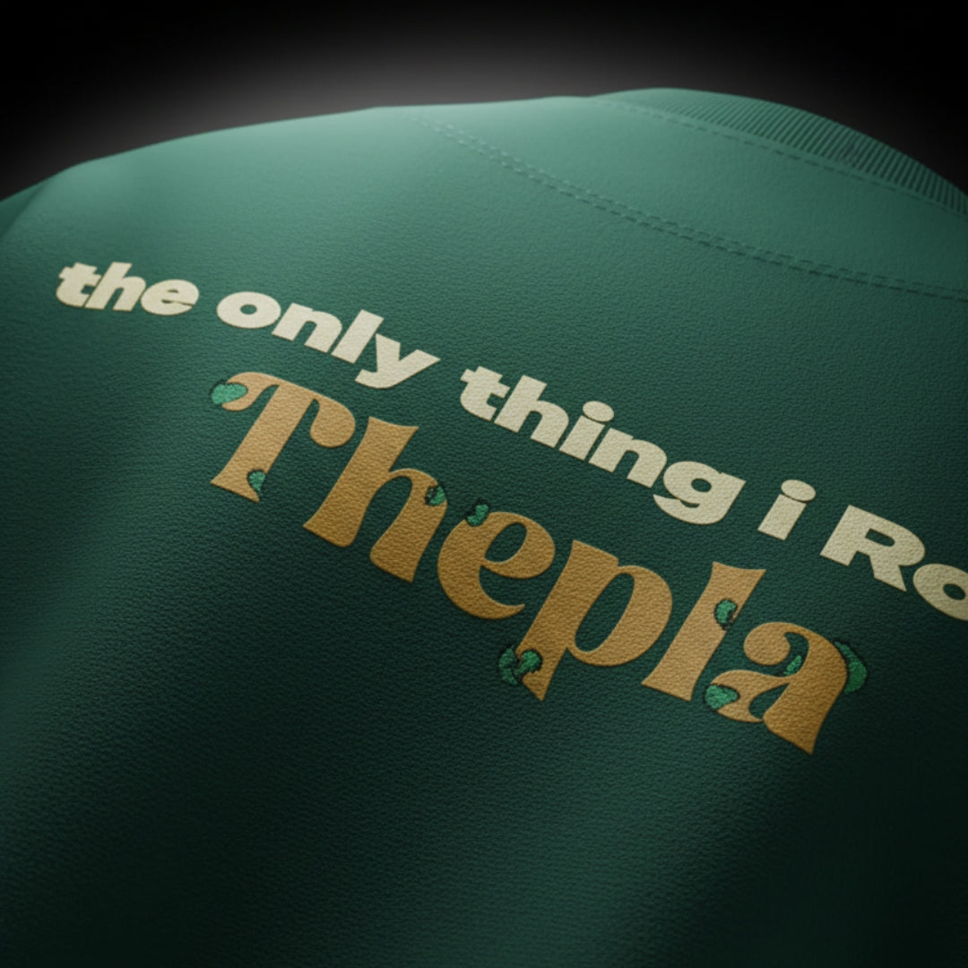 spankers Green shirt with text 'the only thing i Roll is  Thepla' on a dark background