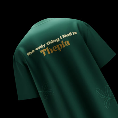 spankers Green t-shirt with text 'the only thing I roll is Thepla' on a black background