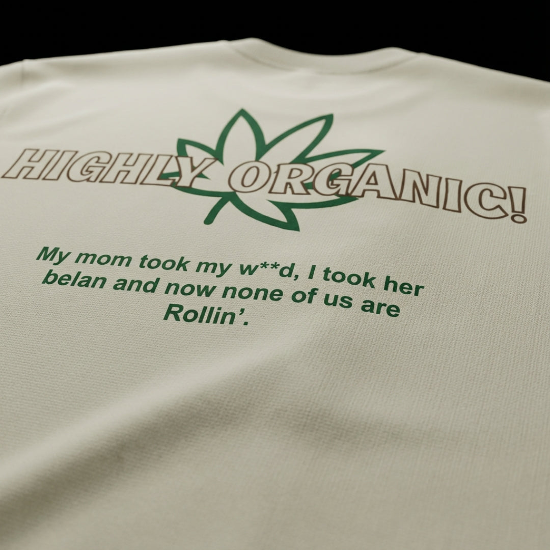 spankers weed tshirt Beige t-shirt with green text and leaf graphic on a black background