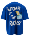 spankers blue t-shirt with the text 'WATER ON THE ROCKS' printed on the back, featuring a graphic of a glass with ice and a lemon slice.