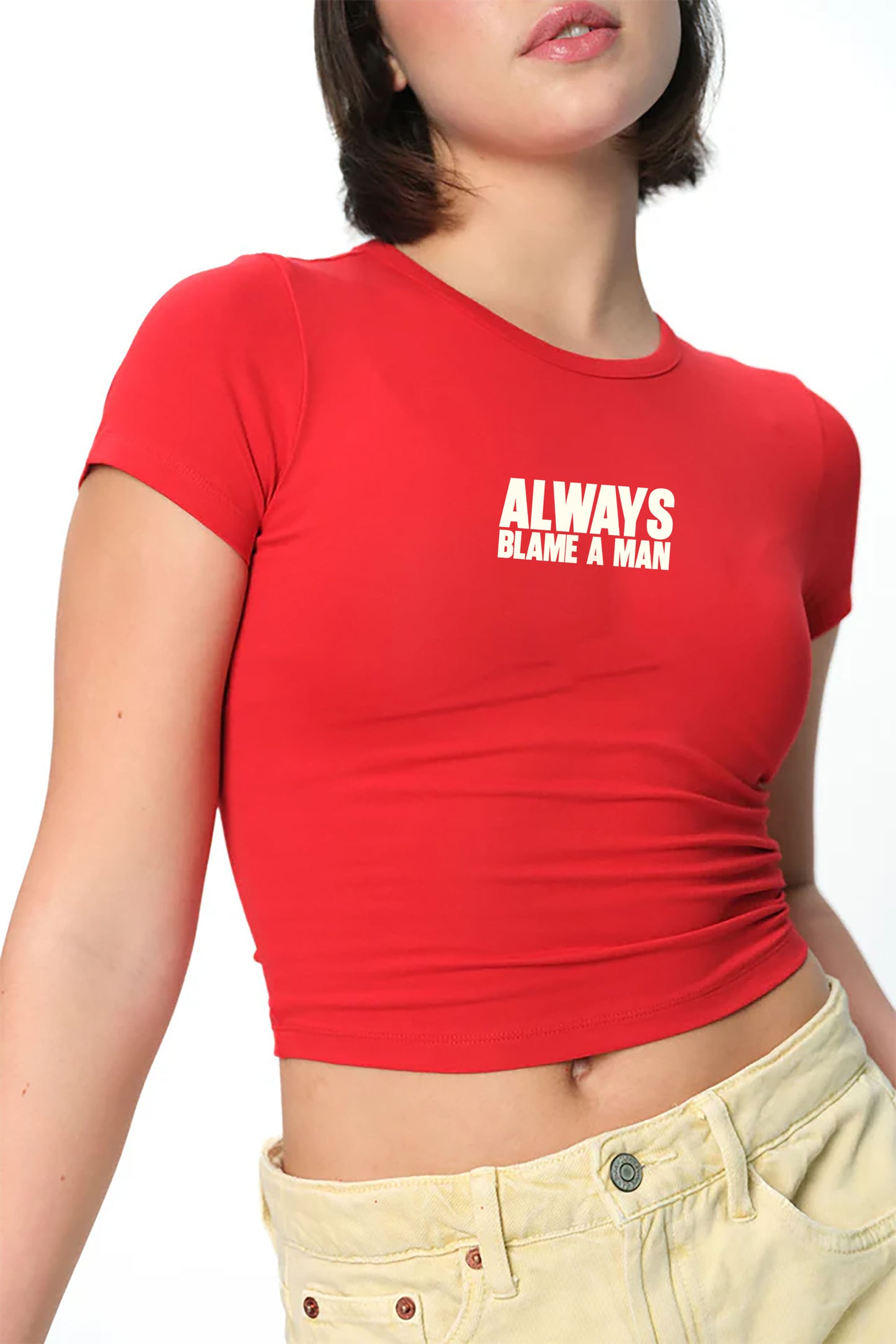 spankers Person wearing a red crop top with text 'ALWAYS BLAME A MAN' on a white background