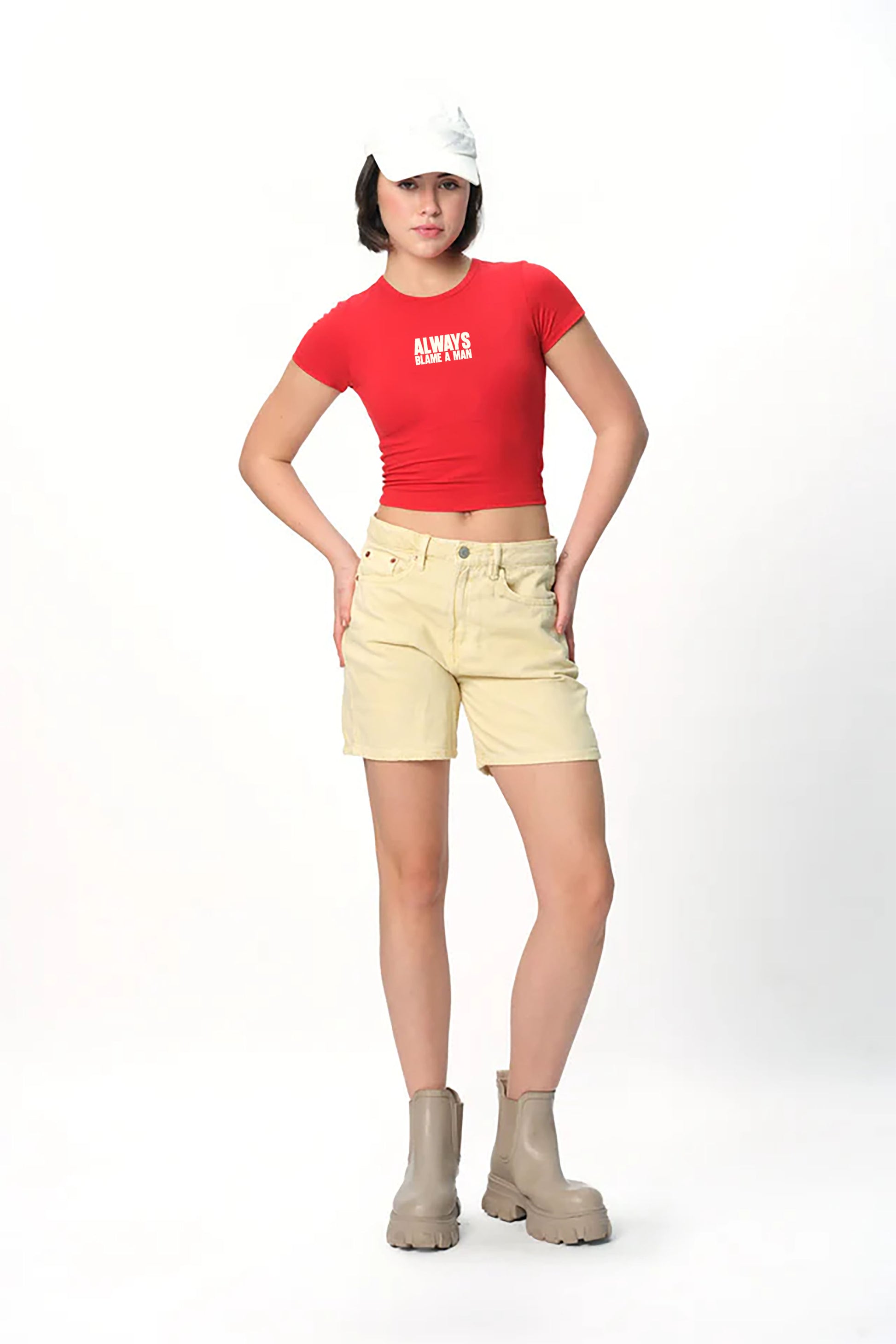 spankers Person wearing a red t-shirt, beige shorts, and white cap on a white background