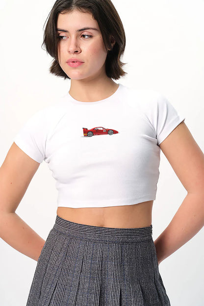 spankers Woman wearing a white crop top with a red car design and a plaid skirt on a white background
