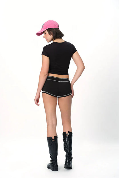 spankers Person wearing a black outfit with a pink cap on a white background
